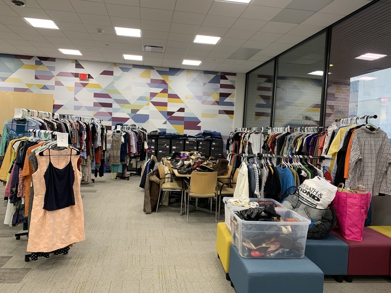 Clothing racks sit in the CIAE for a pop-up closet in October 2022
