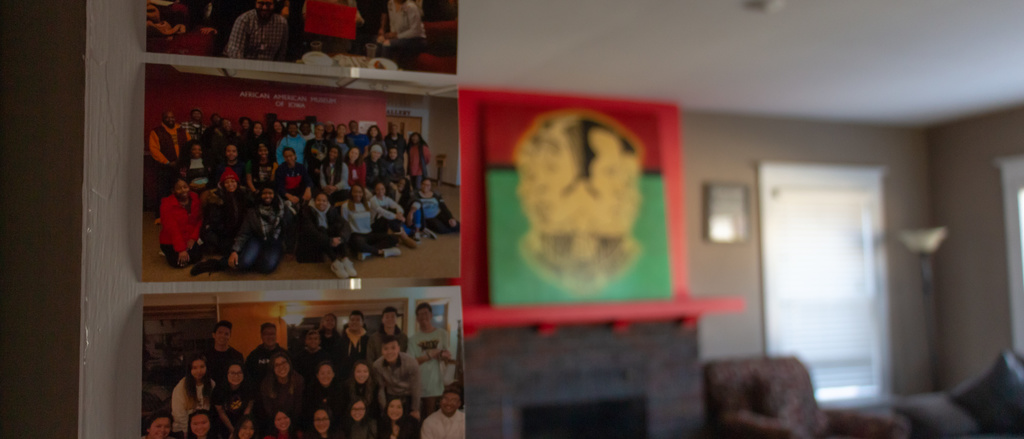 Living room view of the Afro House with large painting and seating area