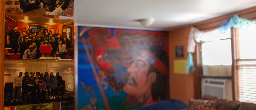 Living room view of the LNACC, including a large wall mural