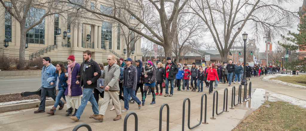 People marching near the Pentacrest